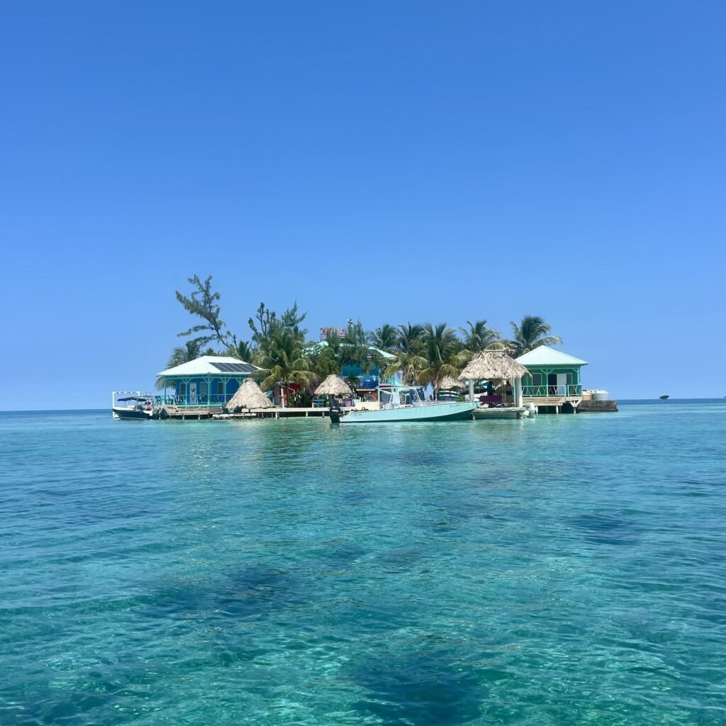 Small caye surrounded by turquoise water in Belize